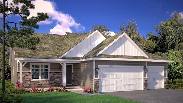 view of front facade with a front yard and a garage