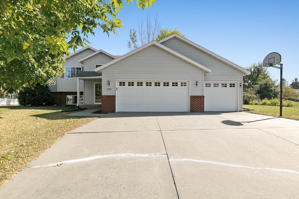 view of front facade with a front lawn and a garage