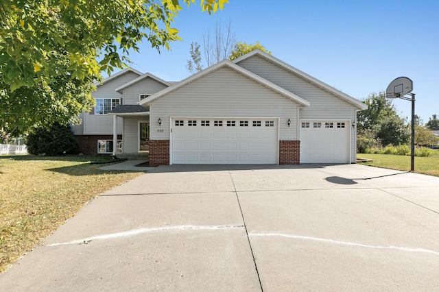 view of front facade with a front lawn and a garage