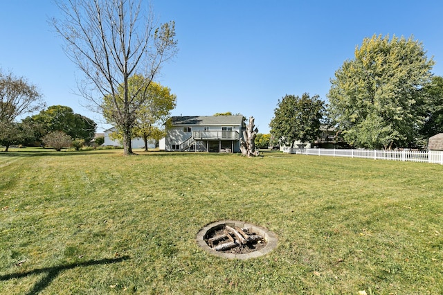 view of yard featuring a fire pit and a deck