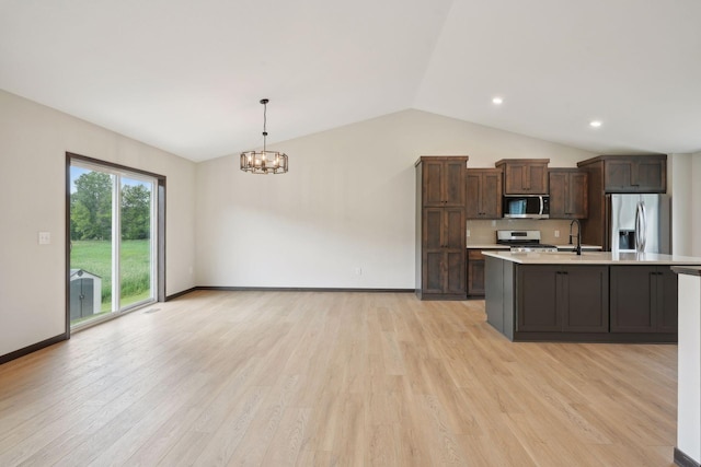 kitchen featuring dark brown cabinets, stainless steel appliances, pendant lighting, light hardwood / wood-style flooring, and a notable chandelier