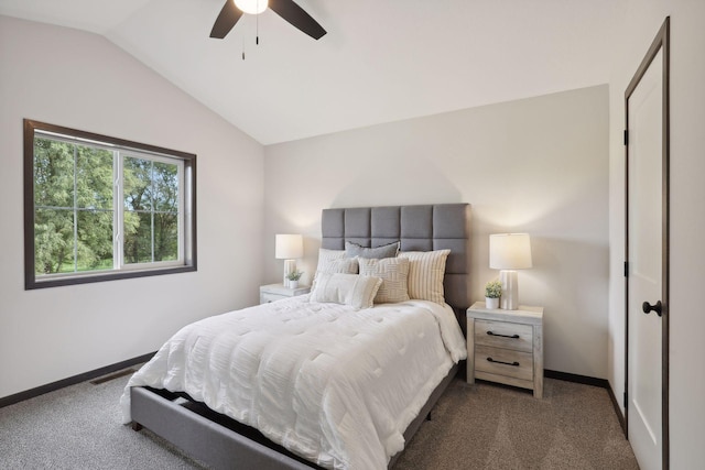 carpeted bedroom with ceiling fan and vaulted ceiling