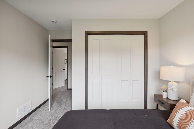 carpeted bedroom featuring a closet