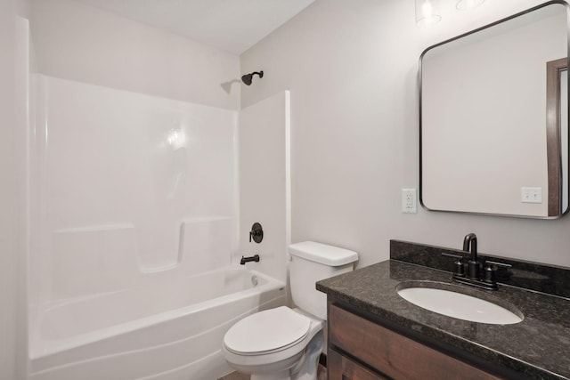 full bathroom featuring vanity,  shower combination, and toilet