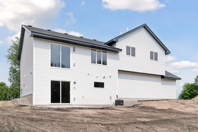 back of house featuring central AC unit