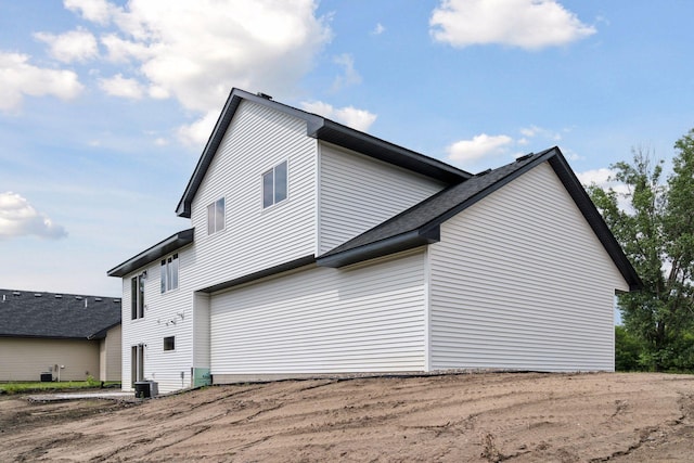 view of side of home featuring central air condition unit