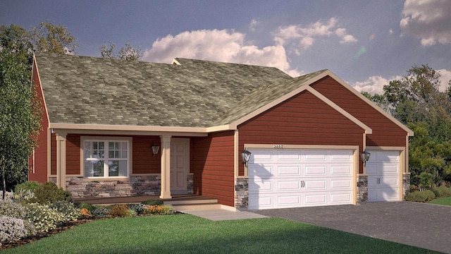 view of front of home featuring a front yard and a garage