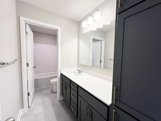 full bathroom featuring shower / bath combination, a textured ceiling, toilet, and vanity