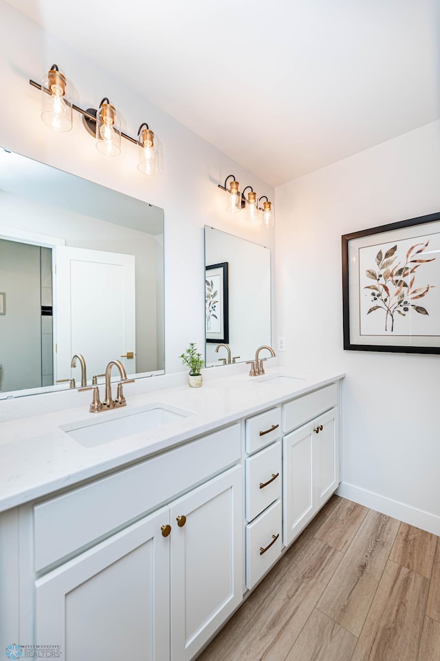 bathroom featuring hardwood / wood-style floors and vanity