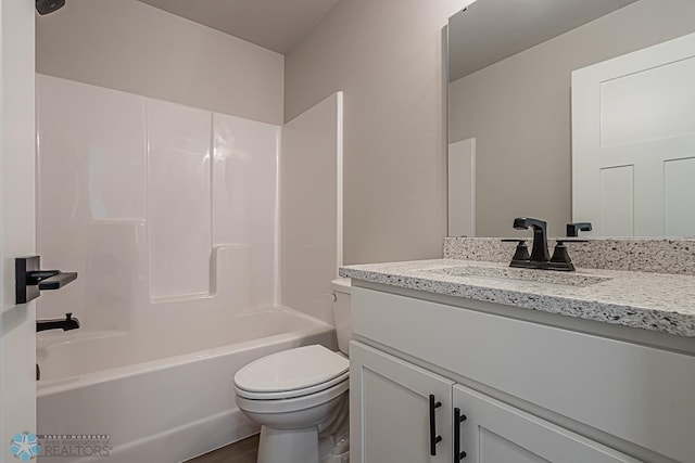 full bathroom featuring vanity,  shower combination, and toilet