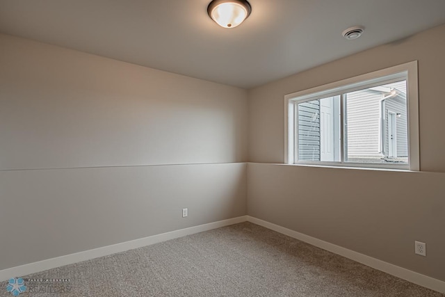 spare room featuring carpet floors