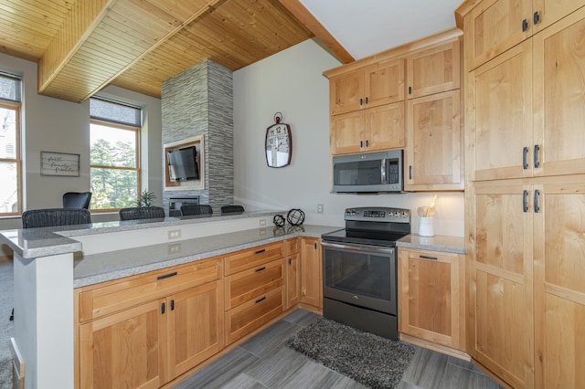 kitchen featuring beamed ceiling, open floor plan, appliances with stainless steel finishes, a peninsula, and wood ceiling