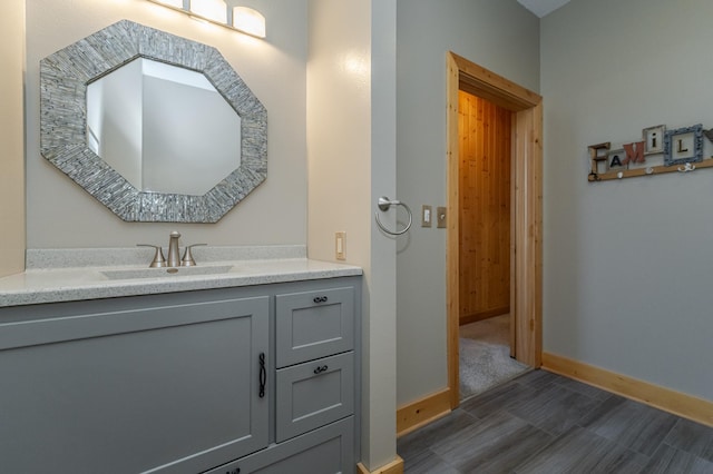 bathroom with baseboards and vanity