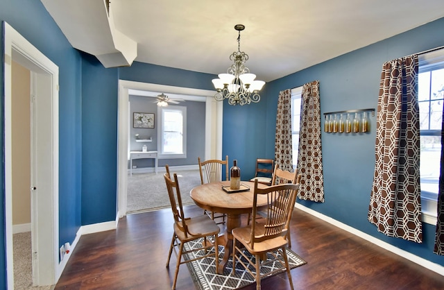 303 Alexandria St NW, Evansville, MN 56326 - dining room with plenty of natural light, dark wood-type flooring, and ceiling fan with notable chandelier