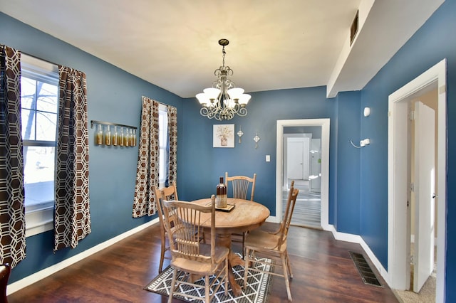 303 Alexandria St NW, Evansville, MN 56326 - dining space featuring dark hardwood / wood-style flooring and an inviting chandelier