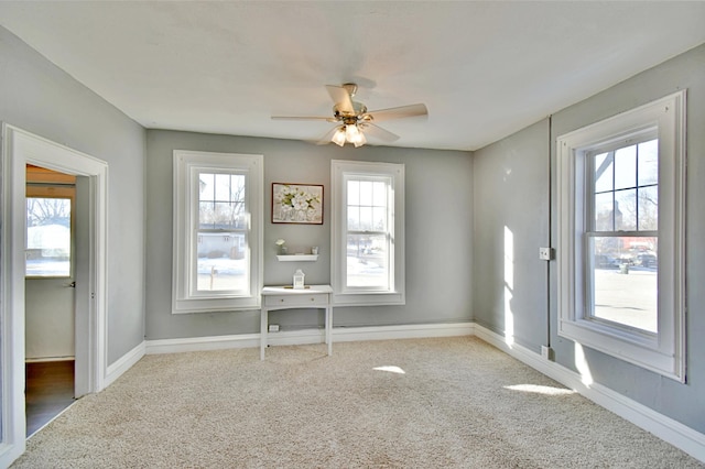 303 Alexandria St NW, Evansville, MN 56326 - carpeted spare room with ceiling fan and a healthy amount of sunlight