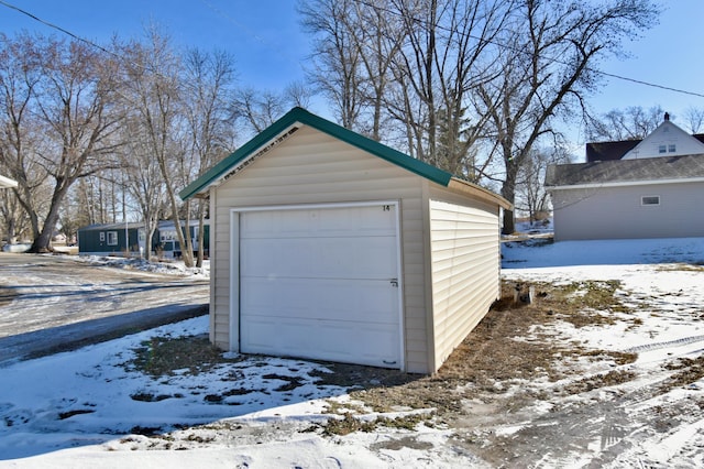 303 Alexandria St NW, Evansville, MN 56326 - view of snow covered garage