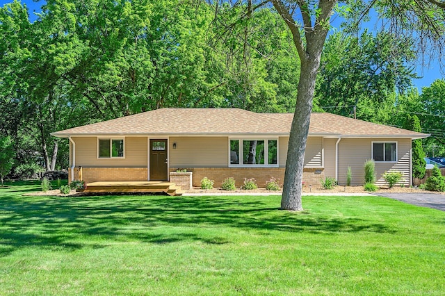 ranch-style home with a front yard