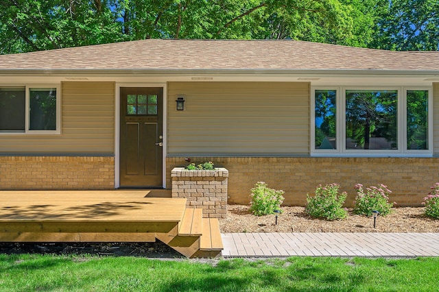 doorway to property with a deck