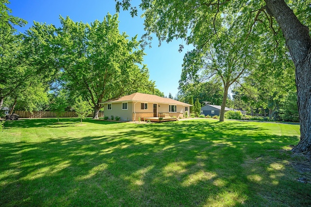 view of yard featuring a wooden deck