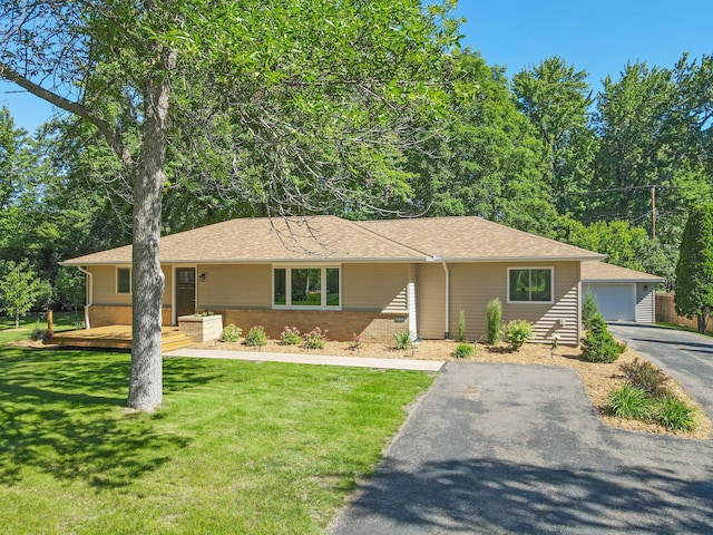 ranch-style home featuring a front yard