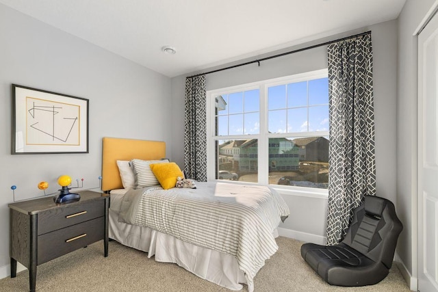 bedroom featuring light colored carpet