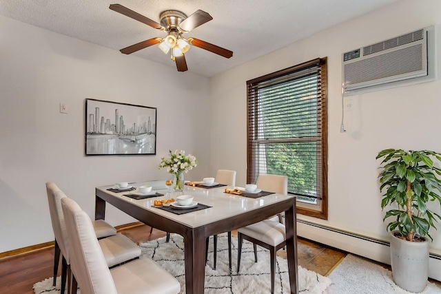 dining area with a textured ceiling, ceiling fan, and a wall mounted AC