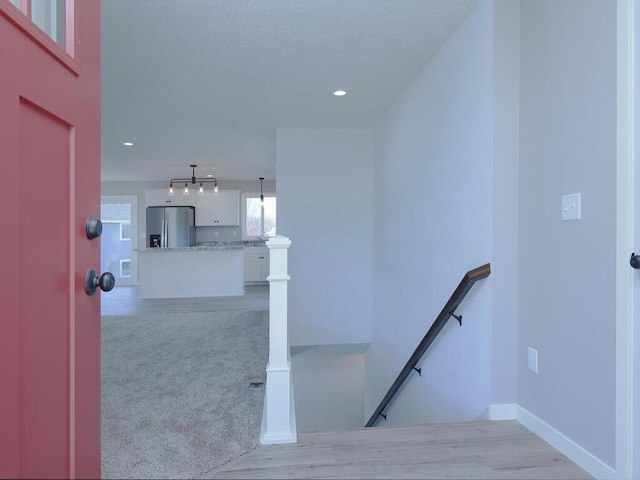 stairs featuring carpet floors