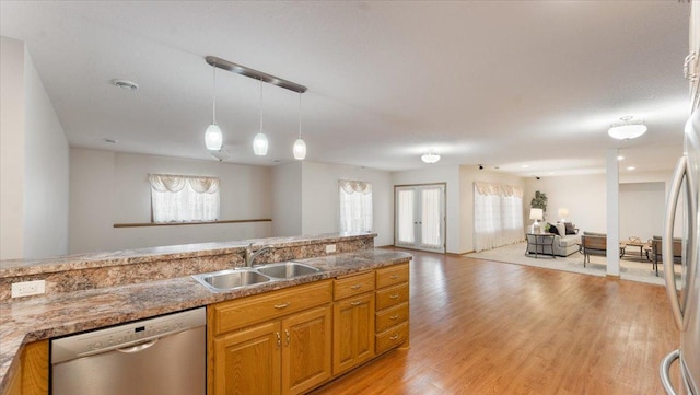 24455 Crocus St NW, Saint Francis, MN 55070 - kitchen with a sink, a wealth of natural light, stainless steel dishwasher, and open floor plan
