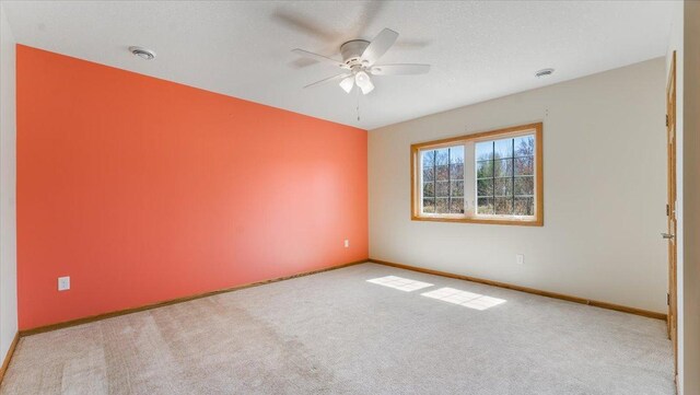 24455 Crocus St NW, Saint Francis, MN 55070 - carpeted empty room featuring baseboards and a ceiling fan