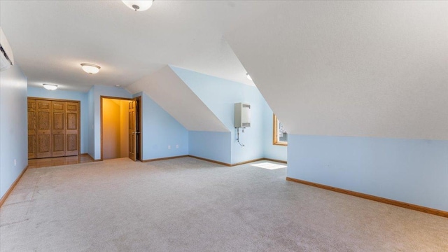 24455 Crocus St NW, Saint Francis, MN 55070 - bonus room featuring carpet floors, baseboards, and vaulted ceiling