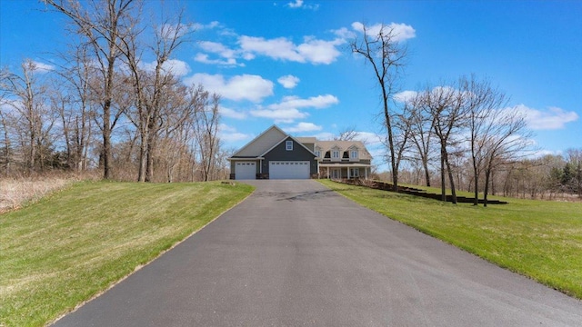 24455 Crocus St NW, Saint Francis, MN 55070 - traditional-style home with an attached garage, driveway, and a front yard