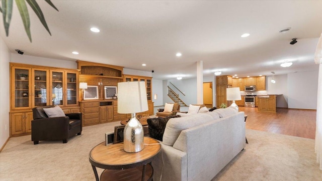 24455 Crocus St NW, Saint Francis, MN 55070 - living room with stairway, recessed lighting, and light colored carpet