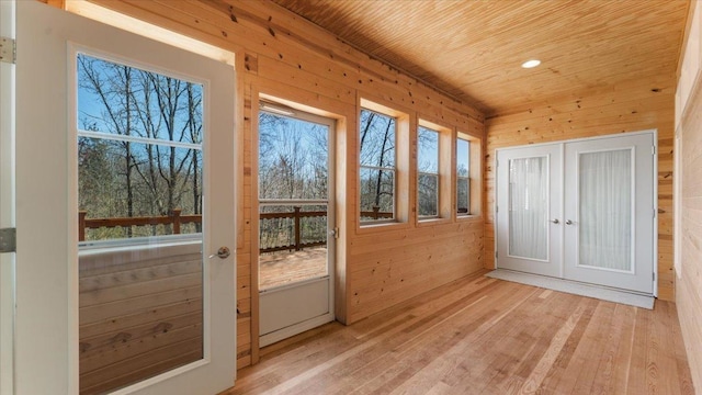 24455 Crocus St NW, Saint Francis, MN 55070 - entryway featuring wood ceiling, light wood-type flooring, french doors, and wood walls