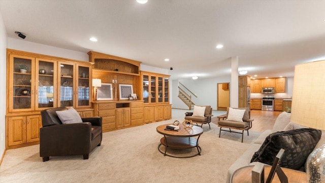 24455 Crocus St NW, Saint Francis, MN 55070 - living room with recessed lighting, stairway, and light colored carpet