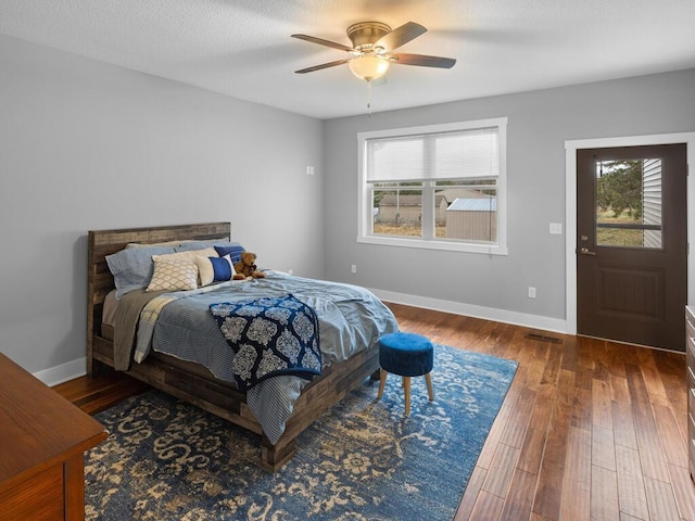 bedroom with ceiling fan and hardwood / wood-style floors