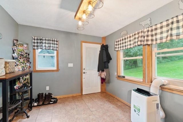 entryway featuring a textured ceiling