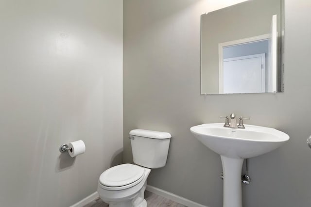 bathroom with toilet and sink