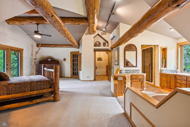 carpeted bedroom with access to exterior, lofted ceiling, rail lighting, and french doors