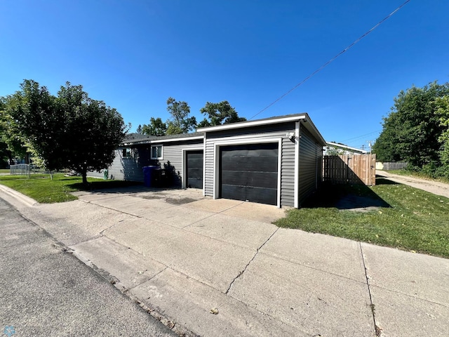 garage featuring a lawn