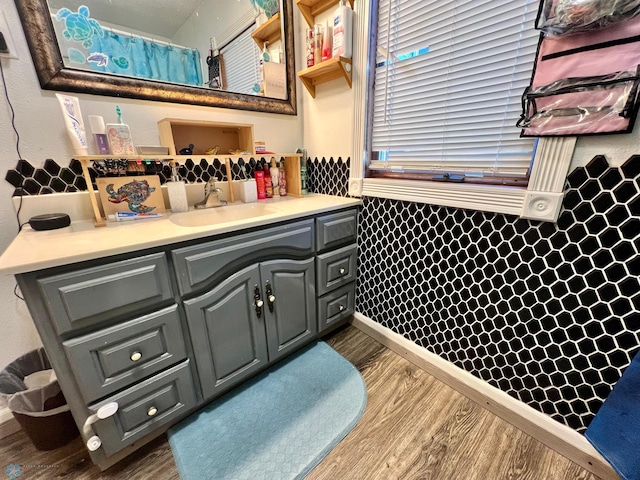 bathroom with vanity and hardwood / wood-style floors