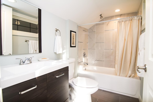 full bathroom featuring shower / tub combo, vanity, and toilet