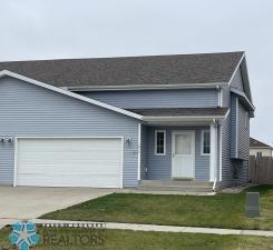 view of front facade with a front yard and a garage