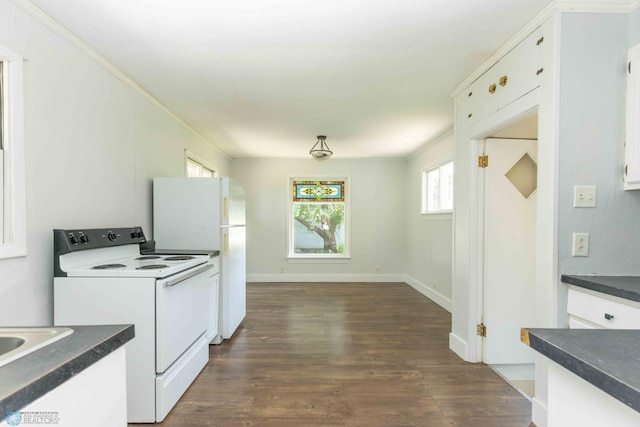 kitchen with white cabinetry, crown molding, dark hardwood / wood-style floors, and white appliances