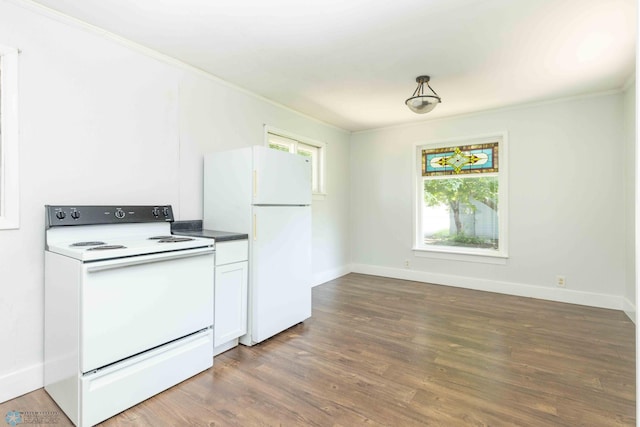 kitchen with white appliances, dark hardwood / wood-style floors, white cabinetry, and crown molding