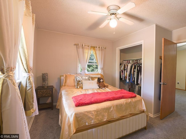 bedroom with carpet, a textured ceiling, a closet, and ceiling fan