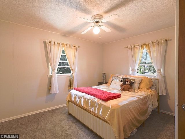 bedroom with carpet flooring, a textured ceiling, and ceiling fan