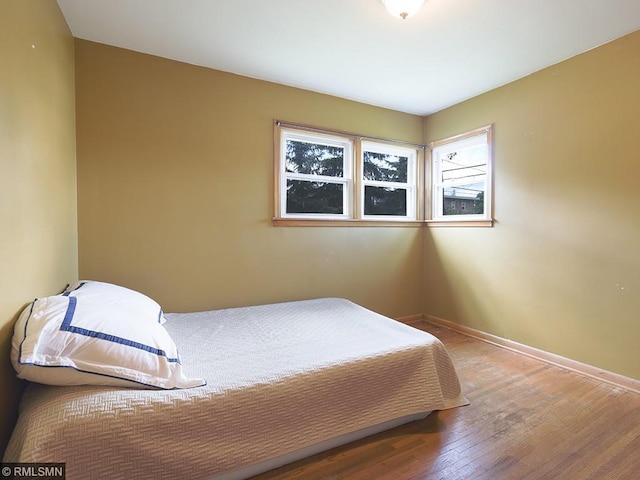 bedroom featuring hardwood / wood-style floors