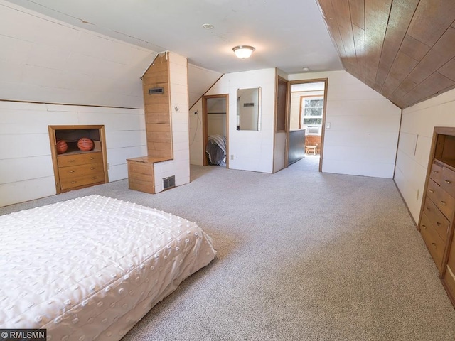 carpeted bedroom featuring electric panel, vaulted ceiling, and wooden ceiling