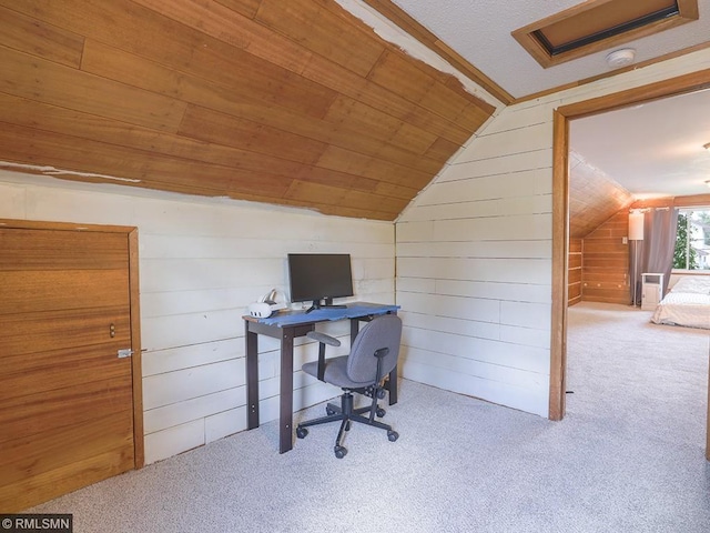 carpeted office with lofted ceiling, wood walls, and wood ceiling